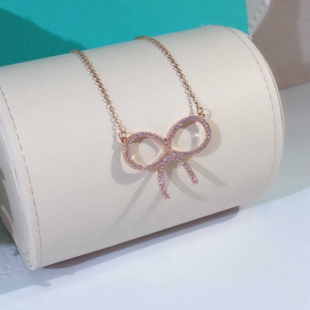 [Reverie Jewels]CLAW SET RHODIUM PLATED BOW NECKLACE