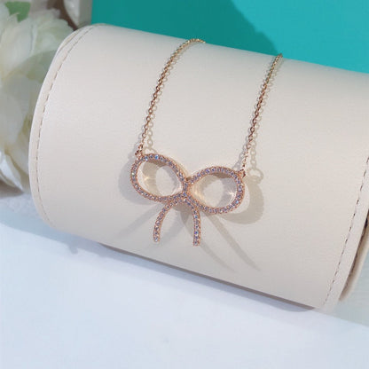 [Reverie Jewels]CLAW SET RHODIUM PLATED BOW NECKLACE